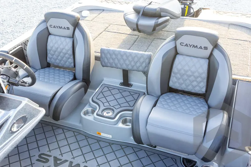 Slide: The Image of 2026 Caymas CX 21 PRO boat interior with gray quilted seats and console. - 39