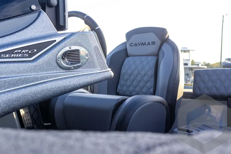 Slide: The Image of 2026 Caymas CX 21 PRO boat interior with premium seating and dashboard details. - 43