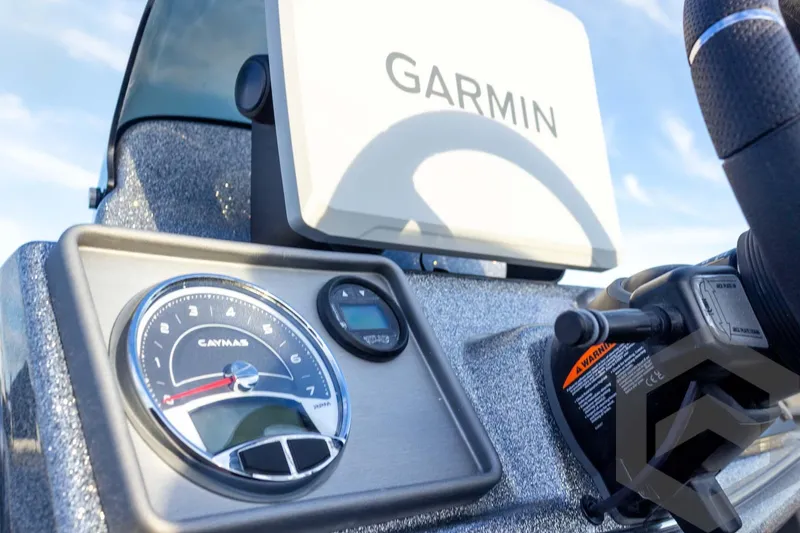 Slide: The Image of 2026 Caymas CX 21 PRO dashboard featuring Garmin navigation system and gauges. - 46