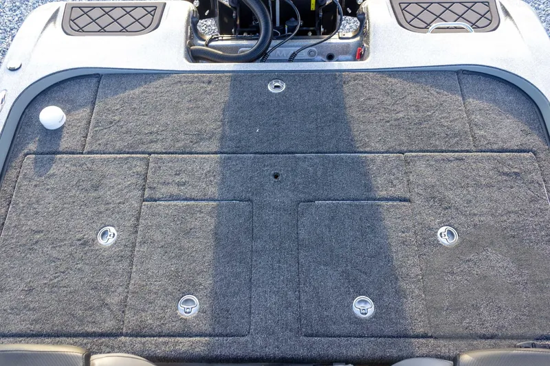 Slide: The Image of 2026 Caymas CX 21 PRO boat deck with storage compartments and carpeted surface. - 48