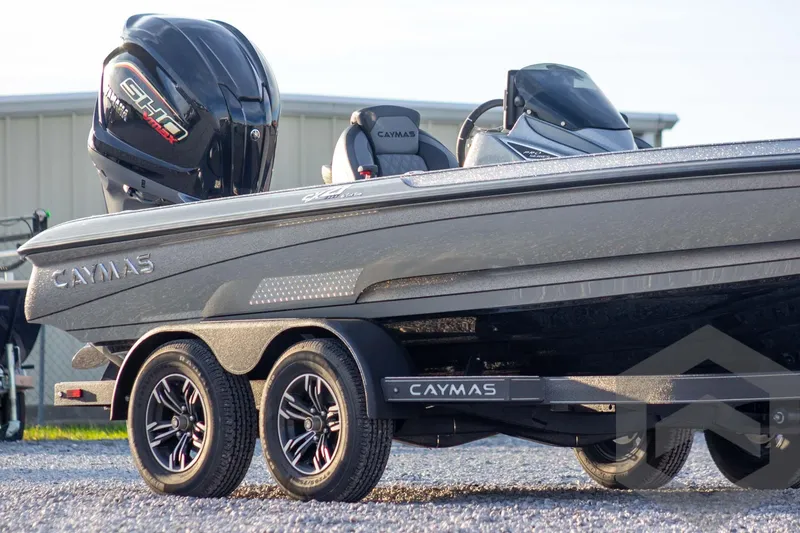 Slide: The Image of 2026 Caymas CX 21 PRO boat on trailer, featuring sleek design and powerful engine. - 5