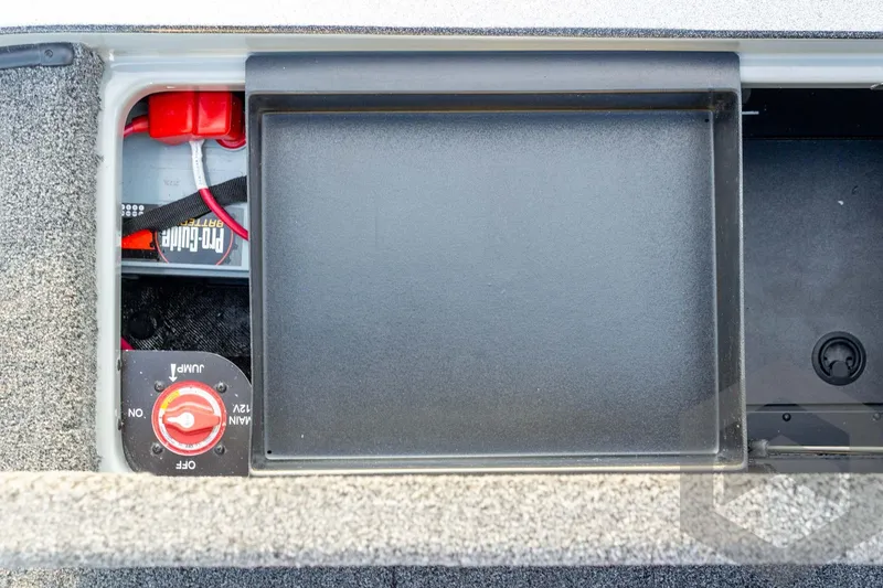 Slide: The Image of 2026 Caymas CX 21 PRO boat battery compartment with Pro Guide battery and switch. - 51