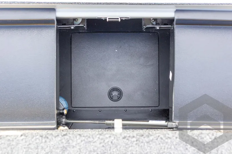 Slide: The Image of Storage compartment of 2026 Caymas CX 21 PRO boat, featuring a sleek black interior. - 52