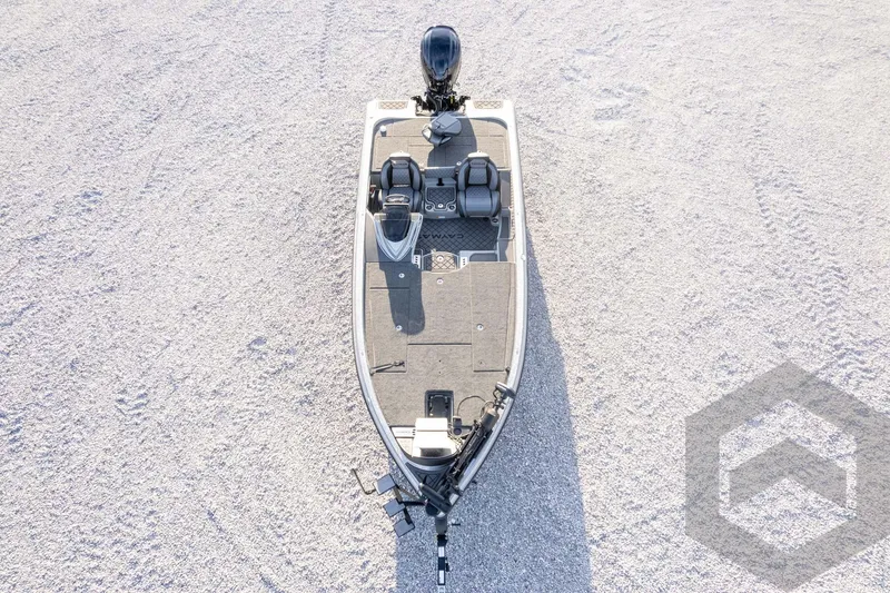 Slide: The Image of 2026 Caymas CX 21 PRO boat, aerial view on gravel surface, showcasing sleek design and spacious deck. - 65