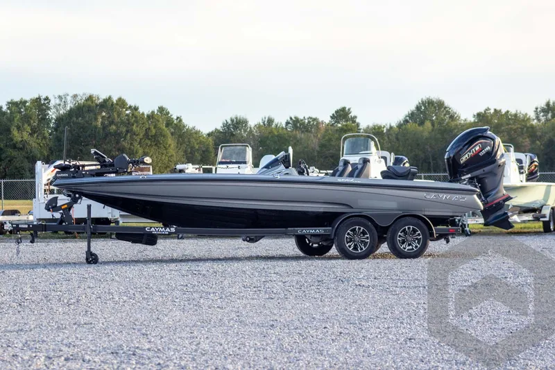 Slide: The Image of 2026 Caymas CX 21 PRO boat on trailer, parked outdoors, side view. - 8
