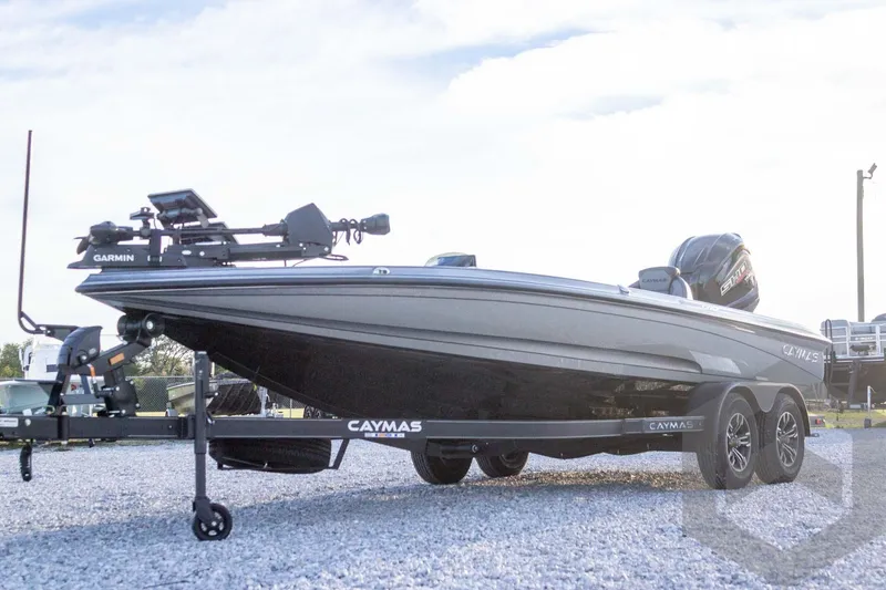 Slide: The Image of 2026 Caymas CX 21 PRO boat on trailer, featuring Garmin equipment. - 9