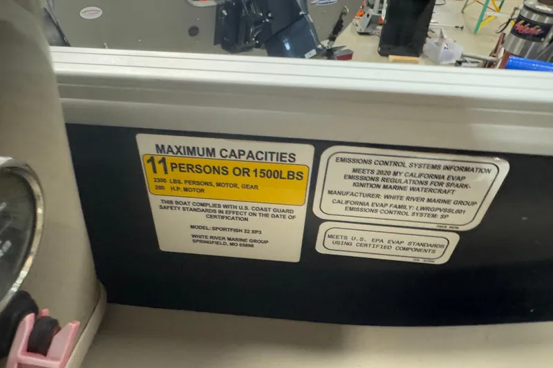 Slide: The Image of 2020 Sun Tracker SportFish 22 XP3 capacity label, 11 persons or 1500 lbs, safety compliance. - 14