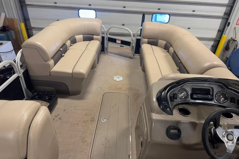 Slide: The Image of 2020 Sun Tracker SportFish 22 XP3 interior with beige seating and control panel. - 19