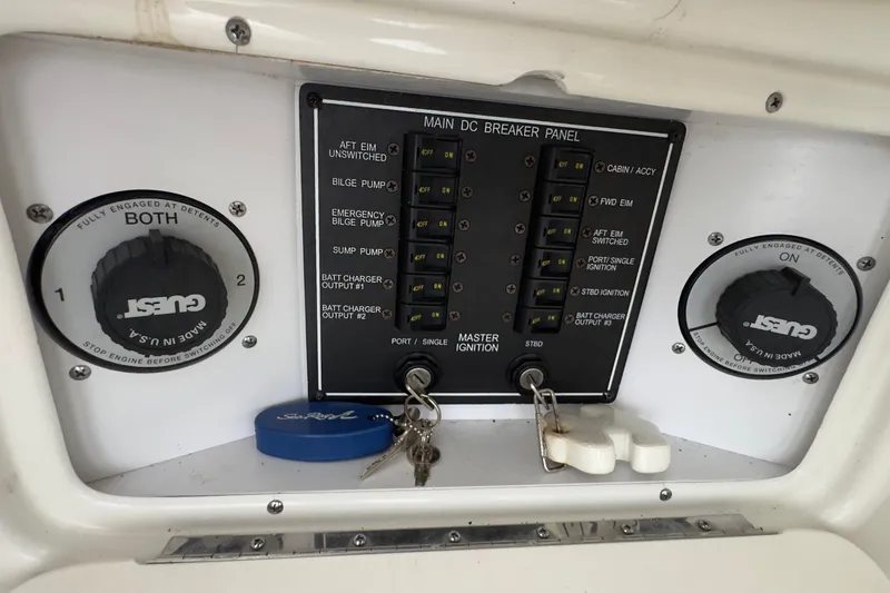 Slide: The Image of Control panel of a 2003 Sea Ray 290 Bowrider boat with ignition keys and switches. - 30
