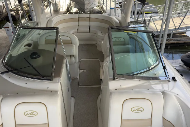 Slide: The Image of 2003 Sea Ray 290 Bowrider interior with spacious seating and sleek design. - 6