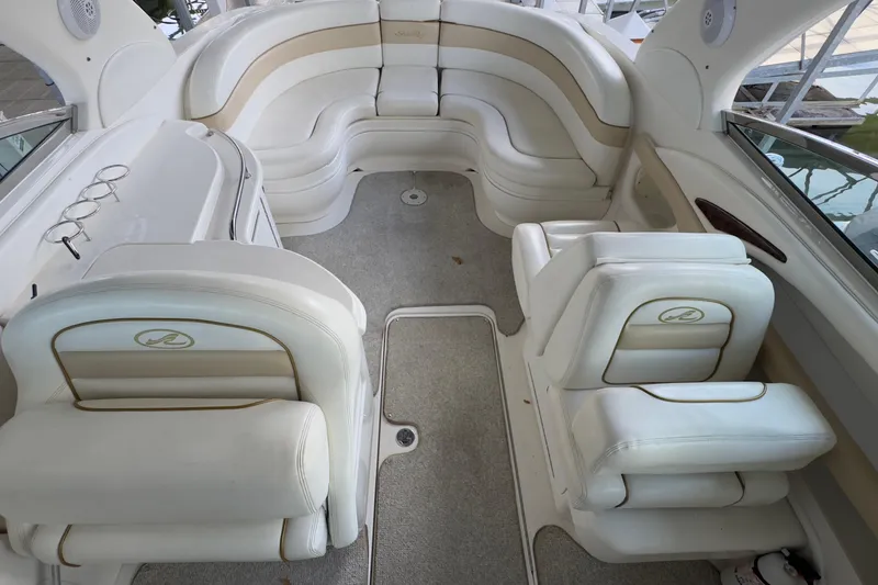 Slide: The Image of Interior of a 2003 Sea Ray 290 Bowrider with white seating and elegant design. - 7