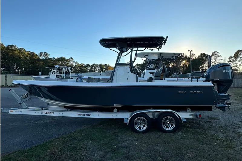 Slide: The Image of 2024 Sea Born FX 25 LE boat on trailer, side view, outdoors. - 5