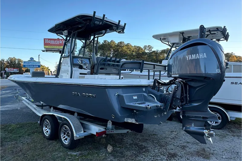Slide: The Image of 2024 Sea Born FX 25 LE boat with Yamaha engine on trailer, outdoor display. - 6