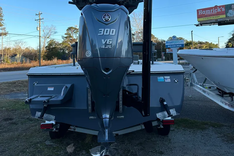 Slide: The Image of 2024 Sea Born FX 25 LE boat with Yamaha 300 V6 engine displayed outdoors. - 7