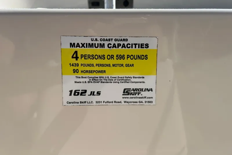 Slide: The Image of 2020 Carolina Skiff 162 JLS capacity label: 4 persons, 596 pounds, 90 horsepower. - 16