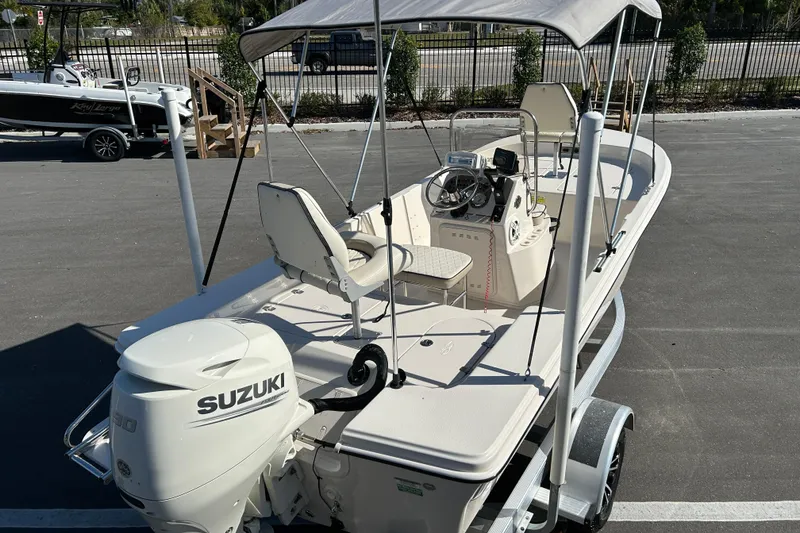 Slide: The Image of 2020 Carolina Skiff 162 JLS boat with Suzuki engine, parked on a trailer. - 7