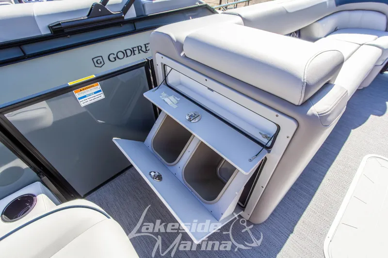 Slide: The Image of 2026 Godfrey Sweetwater 2286 SB boat interior with open storage compartment. - 14