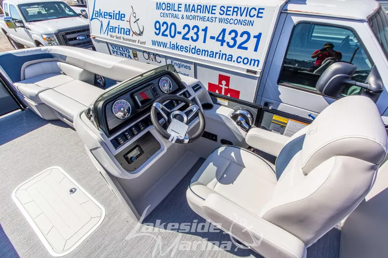 Slide: The Image of Interior of 2026 Godfrey Sweetwater 2286 SB boat with modern dashboard and seating. - 15