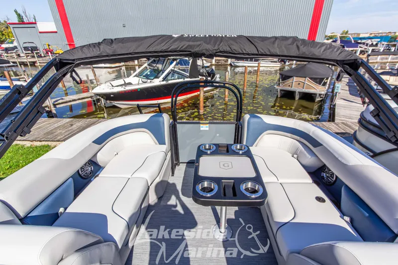 Slide: The Image of 2026 Godfrey Sweetwater 2286 SB pontoon boat interior at marina dock. - 19
