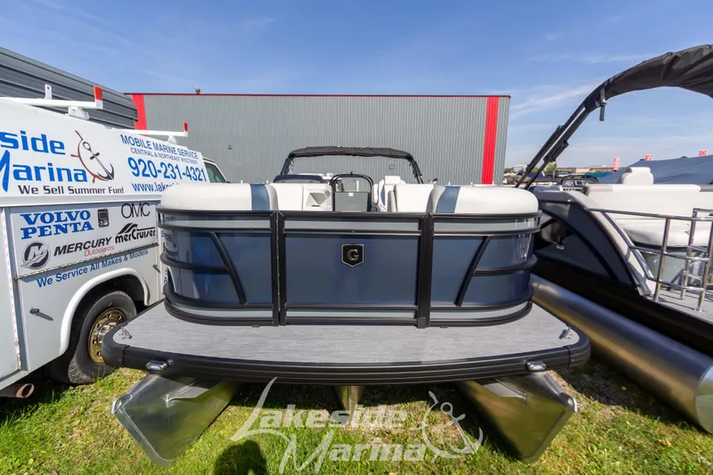 Slide: The Image of 2026 Godfrey Sweetwater 2286 SB pontoon boat at Lakeside Marina display. - 2