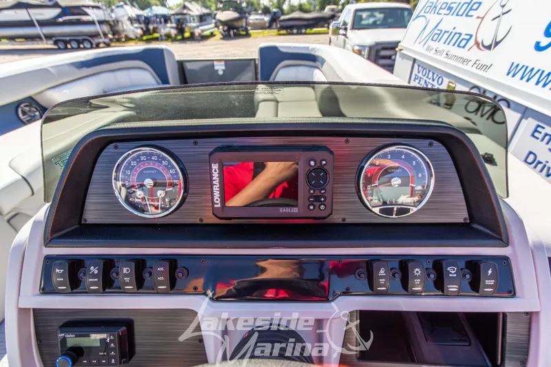 Slide: The Image of 2026 Godfrey Sweetwater 2286 SB dashboard with gauges and Lowrance display at Lakeside Marina. - 16