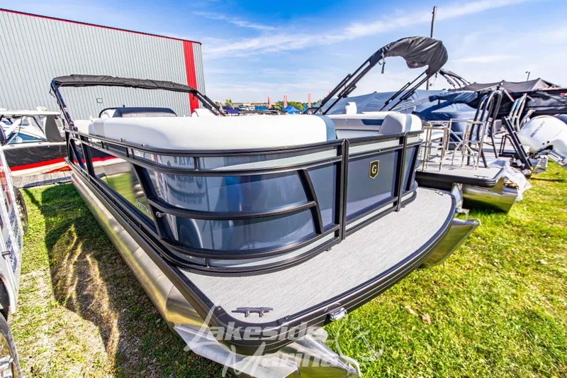 Slide: The Image of 2026 Godfrey Sweetwater 2286 SB pontoon boat displayed outdoors on grass. - 3