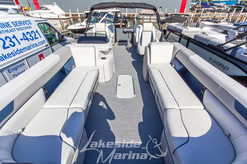 Slide: The Image of 2026 Godfrey Sweetwater 2286 SB pontoon boat with spacious seating at Lakeside Marina. - 4