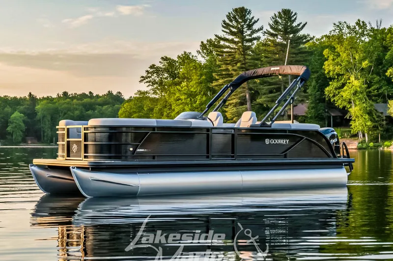 The Image of 2026 Godfrey Sweetwater 2286 SBC pontoon boat on a serene lake at sunset. - 0