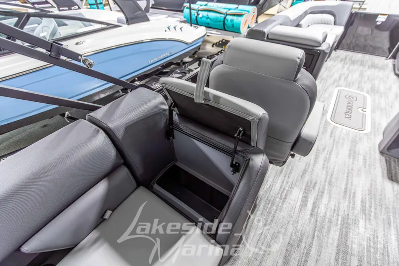 Slide: The Image of Interior of 2026 Godfrey Sweetwater 2286 SBC boat with gray seating and storage compartments. - 28