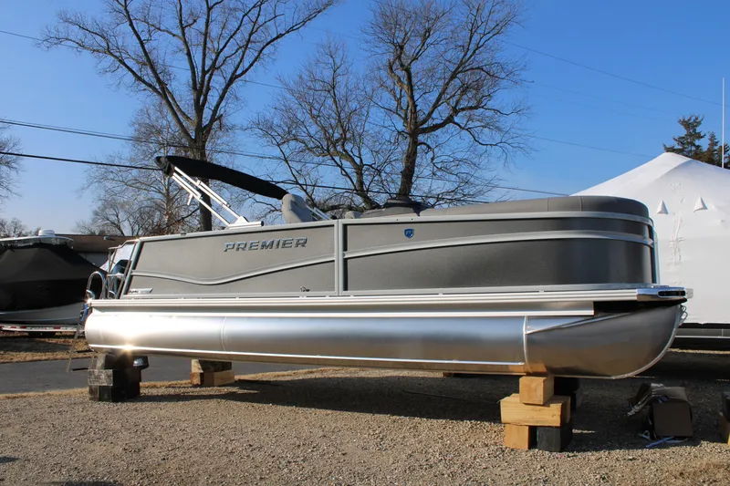 The Image of 2026 Premier 230 Sunsation RF CL pontoon boat on display outdoors. - 0