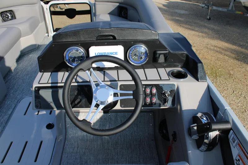 Slide: The Image of Steering console of 2026 Premier 230 Sunsation RF CL boat with Lowrance system. - 11