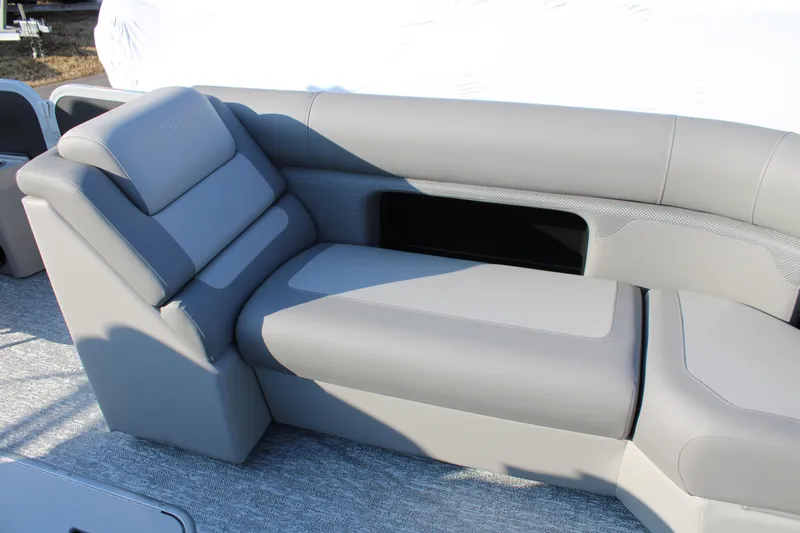 Slide: The Image of Luxurious seating on 2026 Premier 230 Sunsation RF CL pontoon boat, featuring sleek gray upholstery. - 14