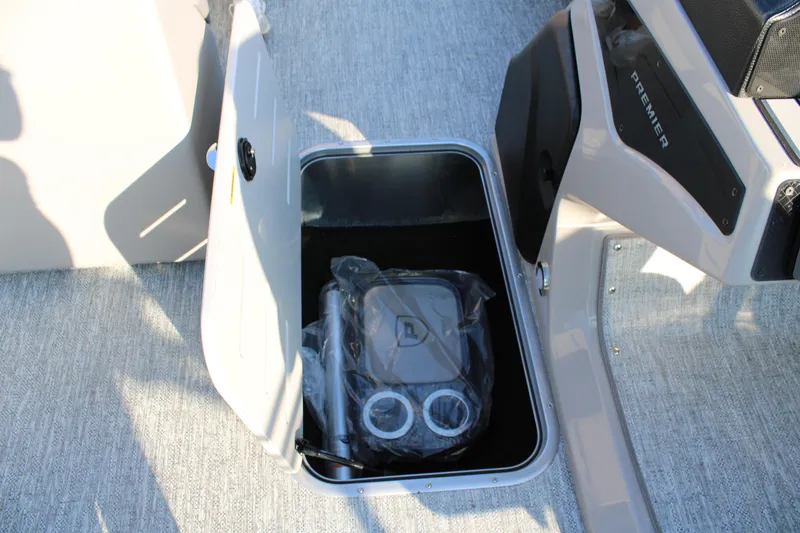 Slide: The Image of Storage compartment in 2026 Premier 230 Sunsation RF CL boat interior. - 17