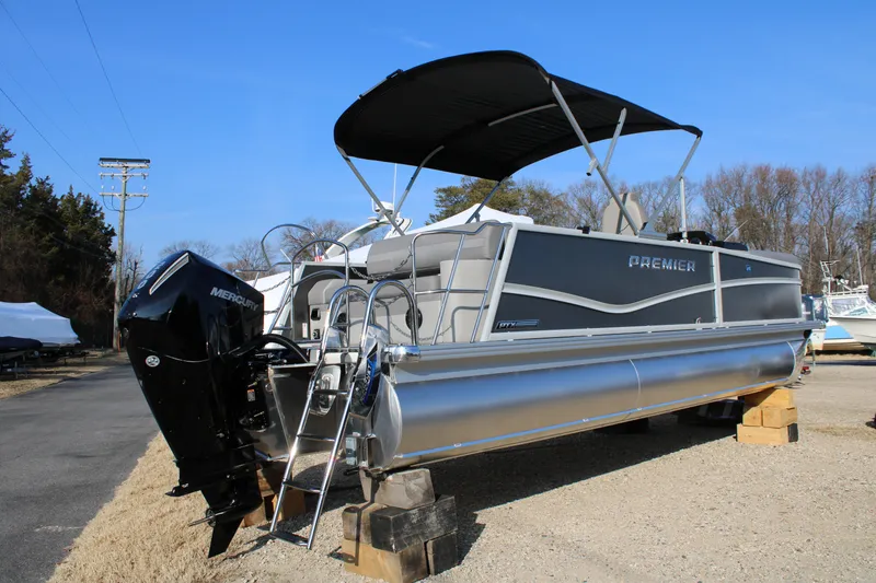 Slide: The Image of 2026 Premier 230 Sunsation RF CL pontoon boat with Mercury outboard engine on display. - 2