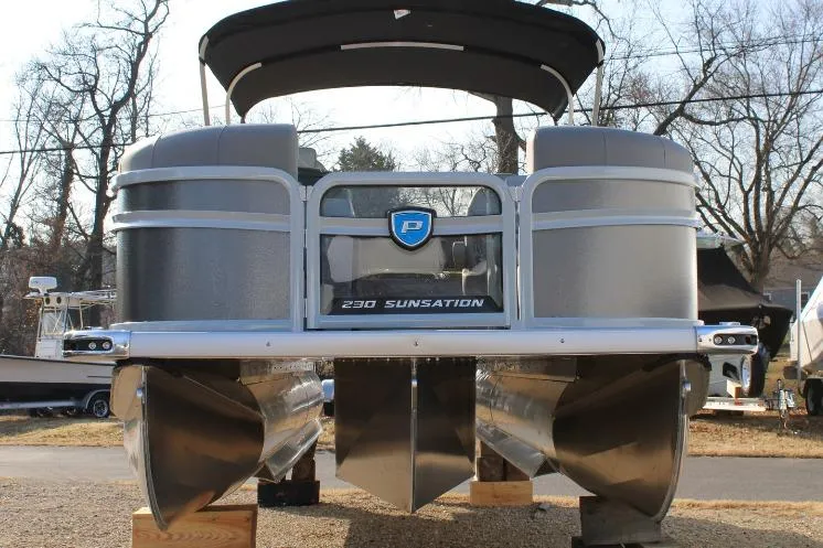 Slide: The Image of 2026 Premier 230 Sunsation RF CL pontoon boat, front view, on display outdoors. - 3