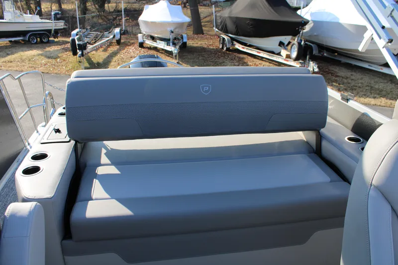 Slide: The Image of 2026 Premier 230 Sunsation RF CL boat interior with gray seating and cup holders. - 5