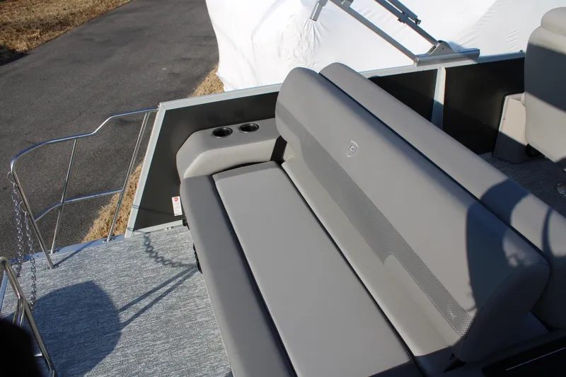 Slide: The Image of 2026 Premier 230 Sunsation RF CL boat with gray seating and cup holders. - 6