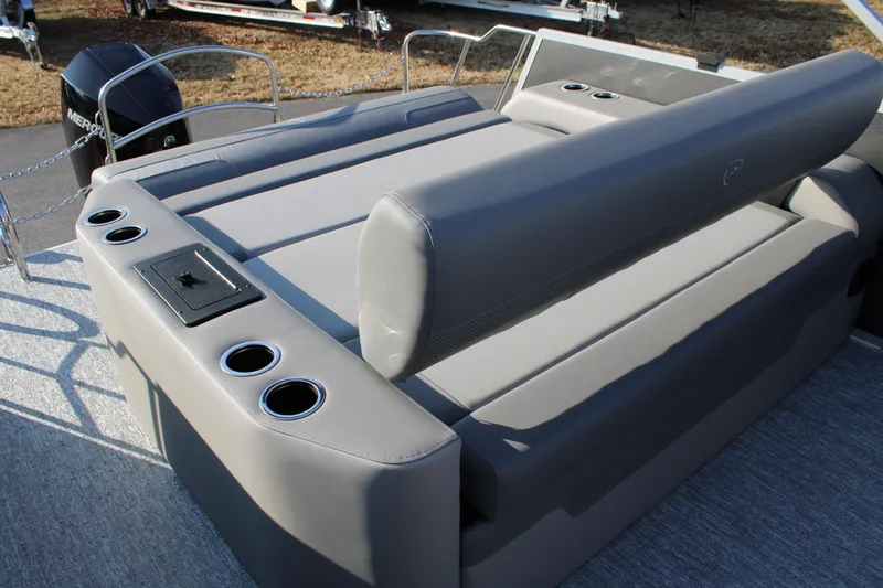 Slide: The Image of 2026 Premier 230 Sunsation RF CL boat interior with gray seating and cup holders. - 7
