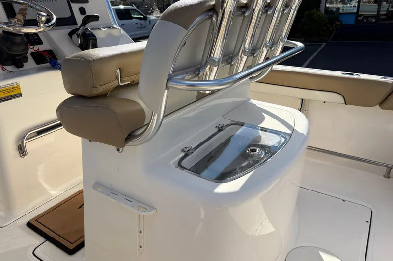 Slide: The Image of 2020 Pioneer 222 Sportfish boat interior with seating and storage compartment. - 10
