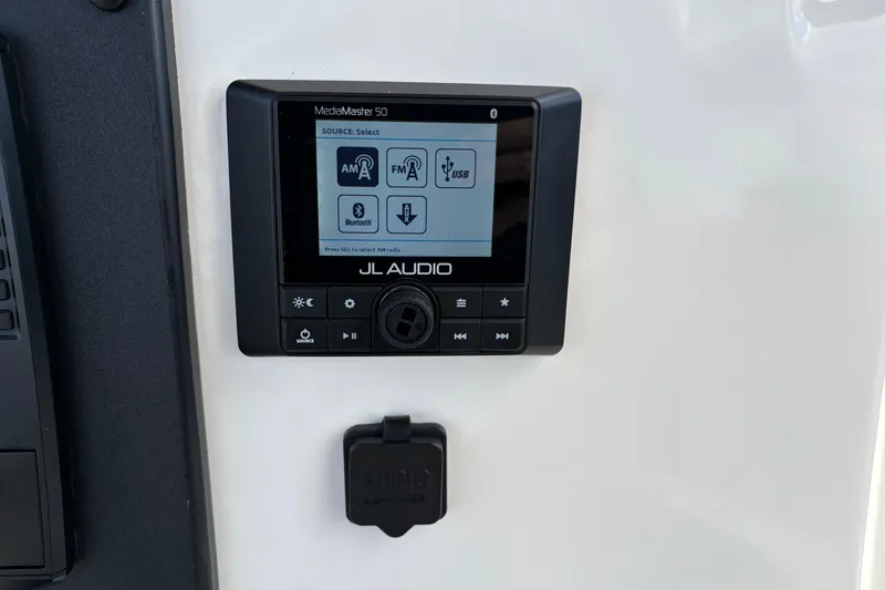 Slide: The Image of JL Audio MediaMaster 50 on 2020 Pioneer 222 Sportfish boat dashboard. - 18
