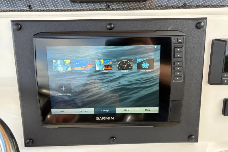 Slide: The Image of Garmin navigation display on 2020 Pioneer 222 Sportfish boat dashboard. - 19
