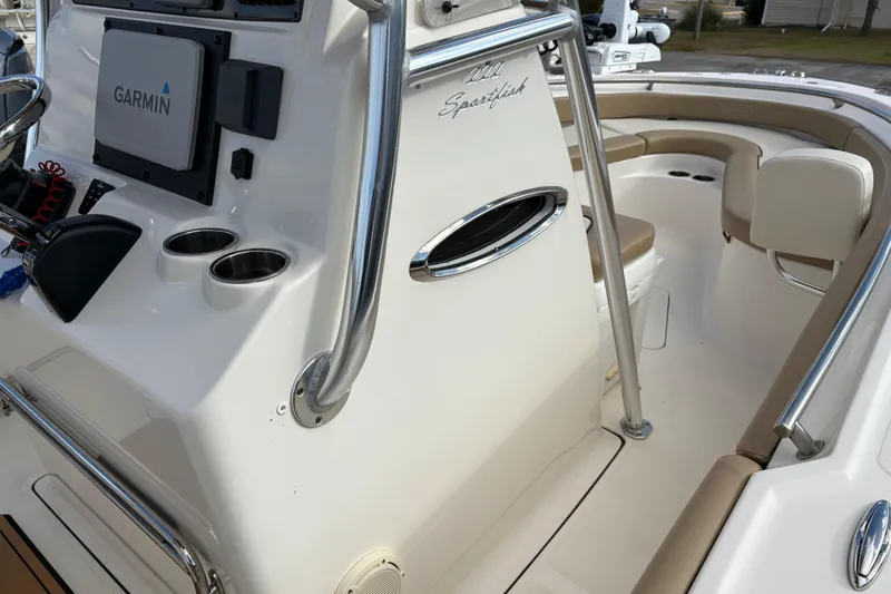 Slide: The Image of 2020 Pioneer 222 Sportfish boat interior with Garmin system and seating area. - 21