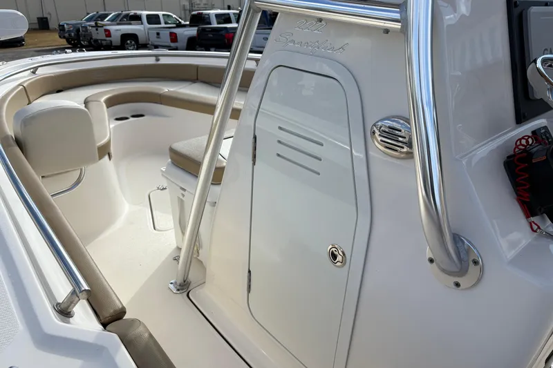 Slide: The Image of 2020 Pioneer 222 Sportfish boat interior with seating and storage area. - 22
