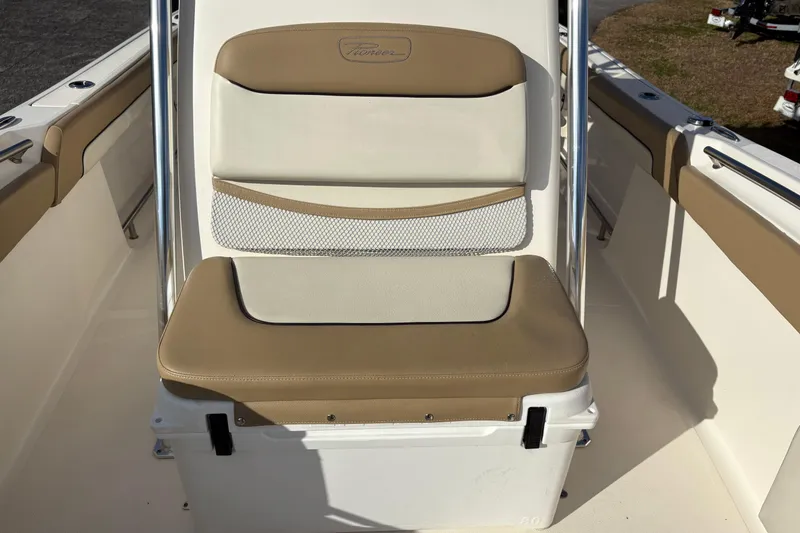 Slide: The Image of 2020 Pioneer 222 Sportfish boat seat with tan and white upholstery. - 27