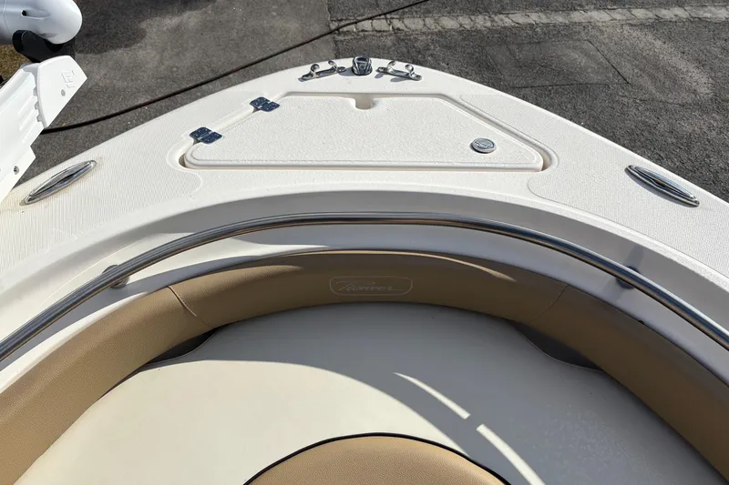 Slide: The Image of Bow of 2020 Pioneer 222 Sportfish boat with seating and storage compartments. - 31