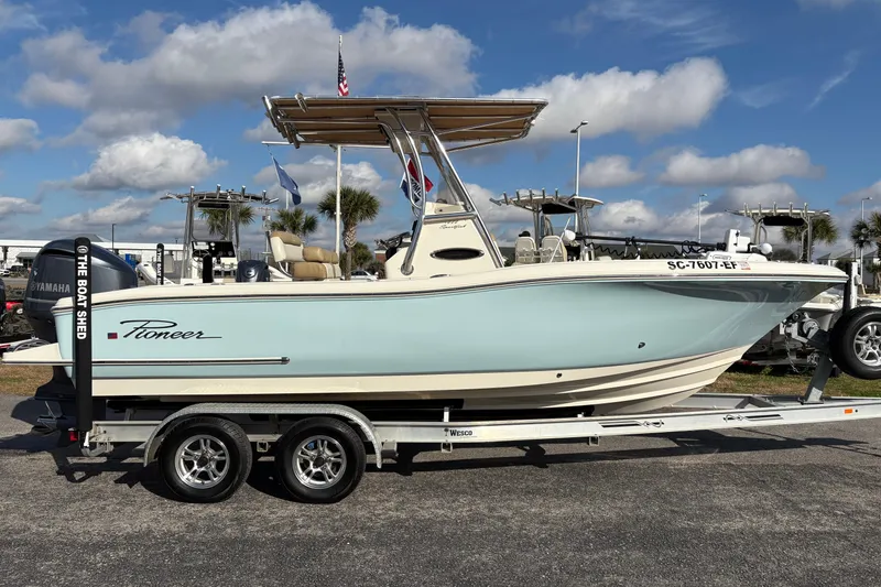Slide: The Image of 2020 Pioneer 222 Sportfish boat on trailer, clear sky background. - 5