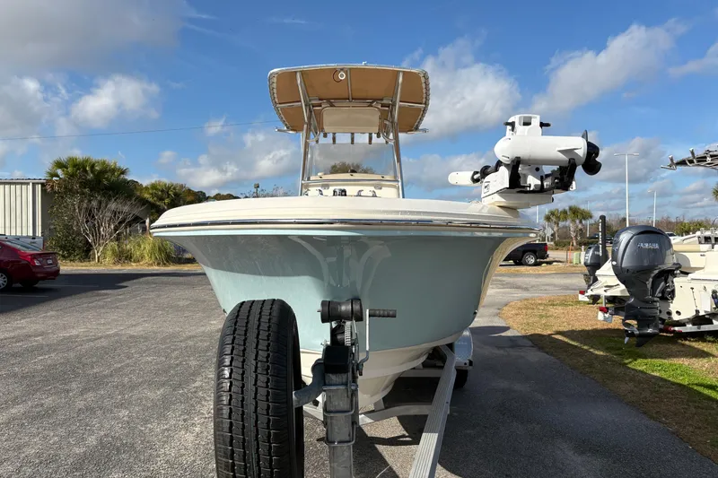 Slide: The Image of 2020 Pioneer 222 Sportfish boat on trailer under blue sky. - 7