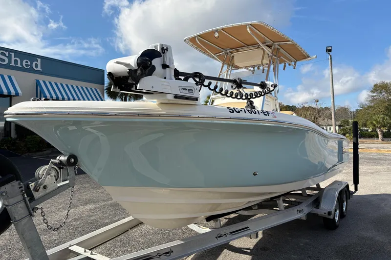 Slide: The Image of 2020 Pioneer 222 Sportfish boat on trailer, featuring a Minn Kota trolling motor. - 8