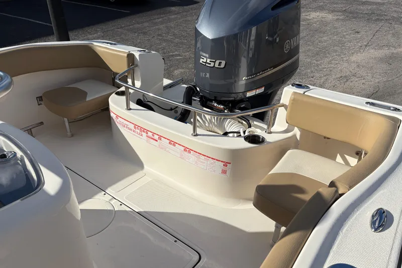 Slide: The Image of 2020 Pioneer 222 Sportfish boat interior with Yamaha 250 engine and seating. - 9
