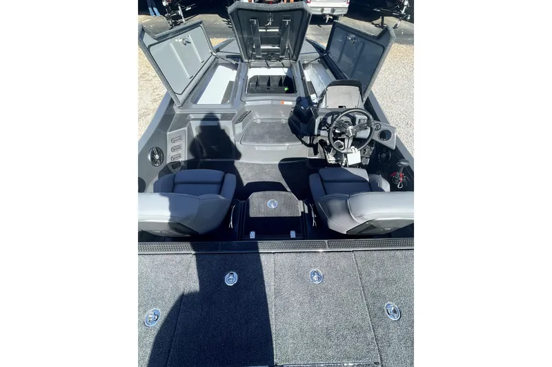 Slide: The Image of 2026 iKon VLX20 boat interior with open storage compartments and dual seating. - 3